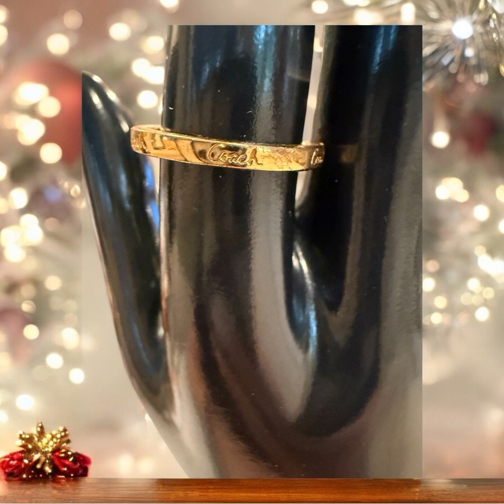 Coach gold tone ring with Coach brand size 7